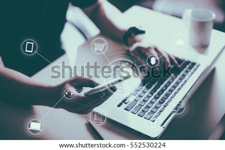 Man holding smart phone making online shopping and banking payment. Blurred background .