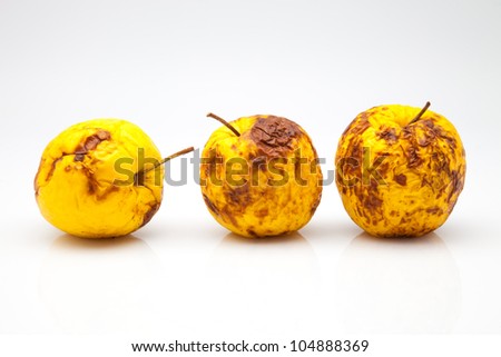 three yellow apples in a bad state