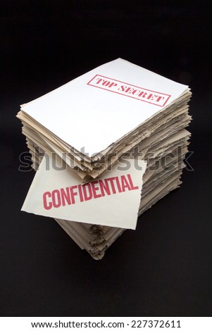 lot of confidential papers on black background