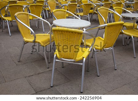 a terrace of cafeteria tables and chairs