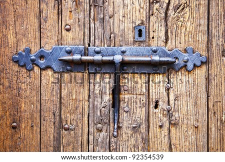 wrought iron lock old wooden door