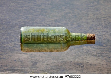 glass bottle floating in the sea