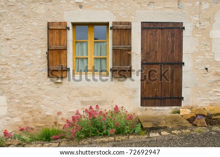A view of french village, door,window and flower.