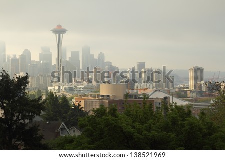 Seattle Skyline, Morning Mist. Fog lingers around downtown Seattle at sunrise. Washington State, USA.