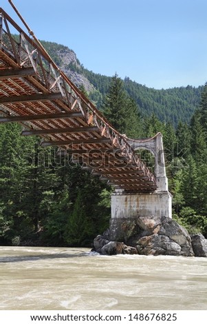 The historic Alexandra Bridge is a steel and concrete suspension bridge crossing the Fraser River north of Yale in southwestern British Columbia. It was built in 1926 to replace an earlier bridge.