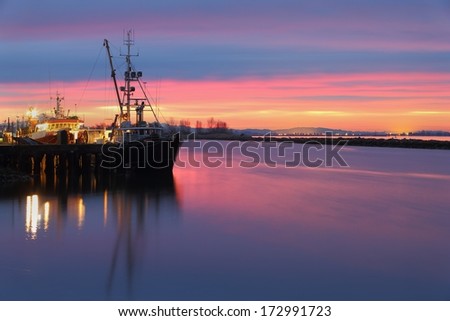 Dawn at the marina in Steveston Harbor, British Columbia, Canada where the commercial fishing fleet prepares to leave the dock. Located at the mouth of the Fraser River near Vancouver.