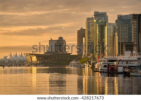 Coal Harbor Morning, Vancouver. Vancouver\'s city center and Coal Harbor at sunrise. Rowing team practice. British Columbia, Canada.