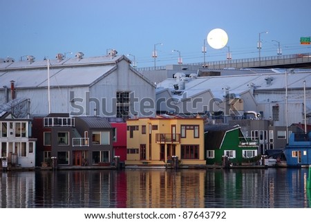 Moon set at dawn over Granville Island and the floating homes of False Creek. Vancouver, British Columbia.