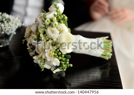 White wedding bouquet on the table