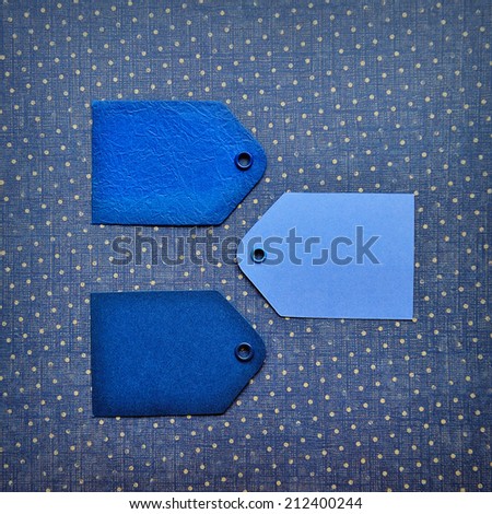 Black Friday shopping sale concept with blue ticket Sale tag close up on blue background.