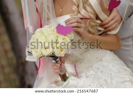 wedding bouquet in hands of the bride of roses