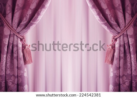purple curtain background, with a  tassell.