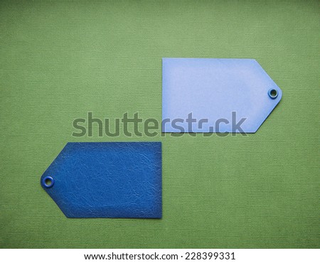 two blue label sale on a green background