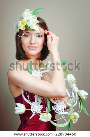 Woman with tulips bouquet of flowers smiling.
