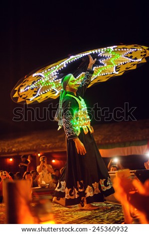 Dubai, UAE, December 10, 2013, a man with a skirt dances national dance.