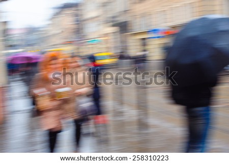 Abstract blur of hurrying people.