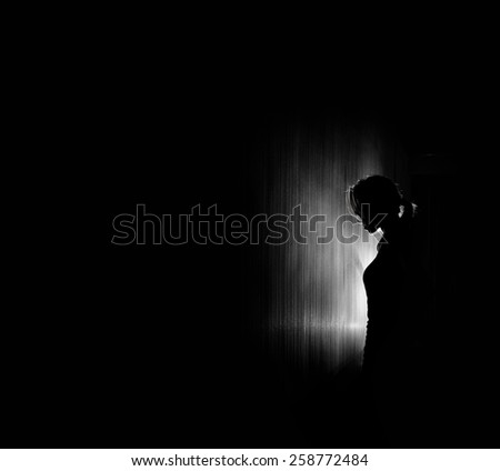 beautiful woman silhouette, black background.
