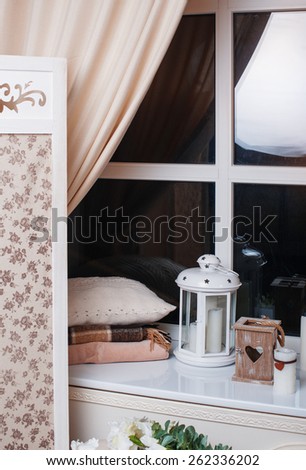 Beautiful decor in beige tones near the window.