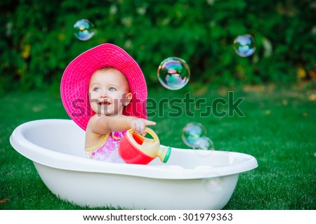 child bathing  with foam bath.