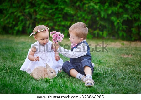 Little boy gives a girl a bouquet of flowers.