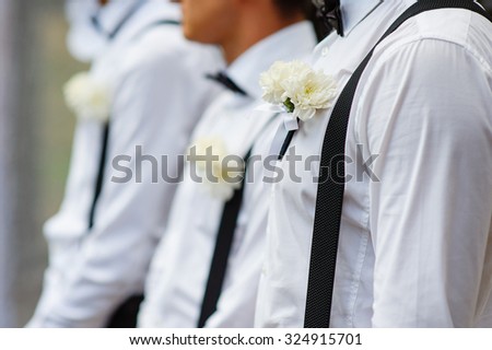 Groom With Best Man And Groomsmen At Wedding.