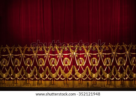 Beautiful Indoor Theater Stage curtains With Dramatic Lighting.