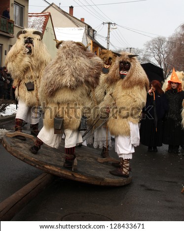 MOHACS/HUNGARY - FEBRUARY 10: Unidentified people wearing masks at the six-day long Mohacsi Busojaras carnival, a ritual aiming to expel winter on February 10,  2013 in Mohacs/Hungary.