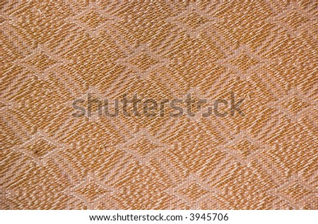 close up diamond or flower like fabric pattern in old couch material