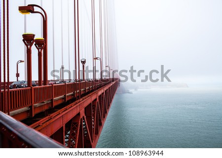 Golden Gate bridge in the fog, San Francisco, CA