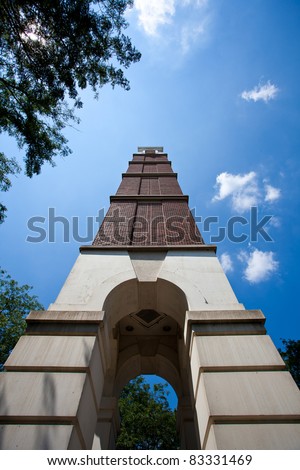 Worm\'s eye view of tall brick tower under blue sky