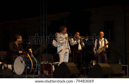 SIBIU, ROMANIA - JUNE 16: Goran Bregovic and His Wedding And Funeral Orchestra performs on stage at International Movie Festival on June 16, 2011 in Sibiu, Romania