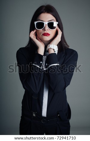 Portrait of professional model in black shirt and sunglasses