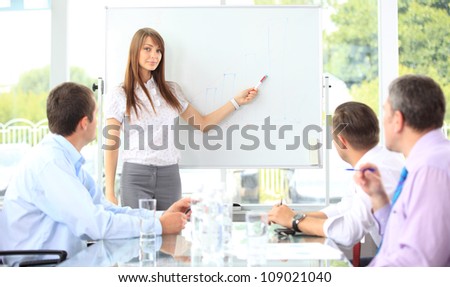 Woman making a business presentation to a group
