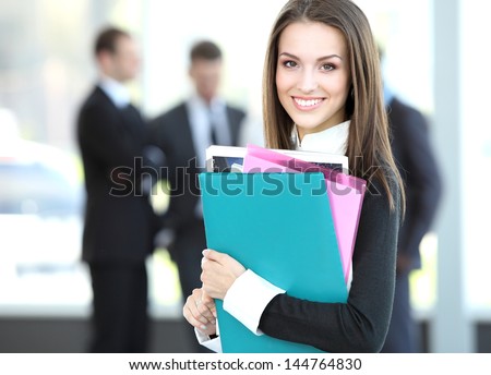 Face of beautiful woman on the background of business people