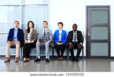 Business people waiting for job interview. Five candidates competing for one position