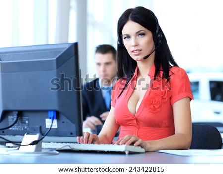 Female customer support operator with headset and smiling