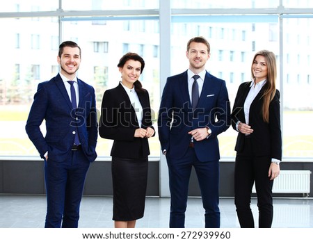 Happy smiling business team in office