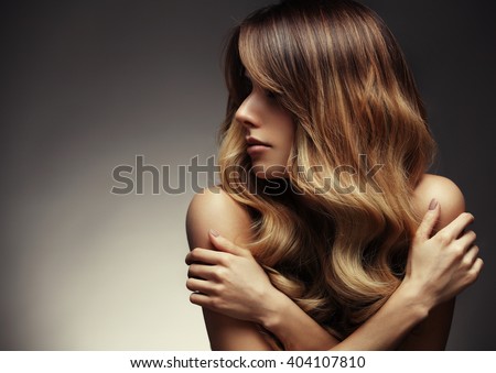 Beautiful blonde woman with long, healthy , straight and shiny hair. Hairstyle loose hair