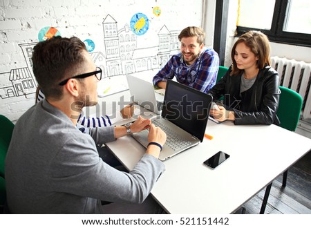 Young professionals work in modern office.Business crew working with startup.