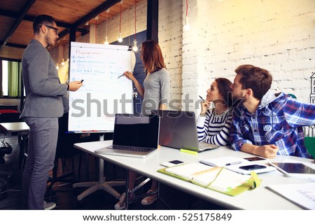 Woman making a business presentation to a group