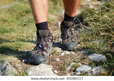 Hiking Boots/Hiking Boots and Legs of a Man on the Mountain Path