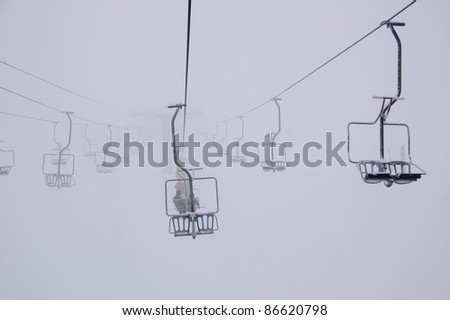 Chair lift/Chair lift in Fogy Winter Day