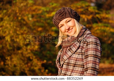 Autumn Portrait/ outdoor portrait of beautiful young woman with  autumn foliage background