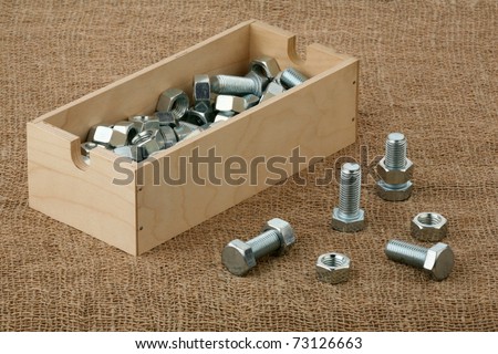 Bolts and nuts and a plywood box
