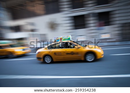 NEW YORK - JUNE 03: A New York taxi cab driving down a Manhattan street in New York, United States of America on June 03, 2011.