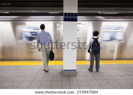 NEW YORK, MAY 30: Commuters wait to board a train on the New York underground metro, in New York, United States on May 30, 2011