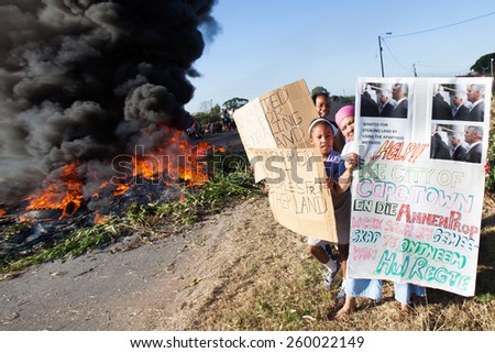 CAPE TOWN, SOUTH AFRICA - JANUARY 31: A large group of people protest against poor service delivery, in Cape Town, South Africa on January 31, 2012