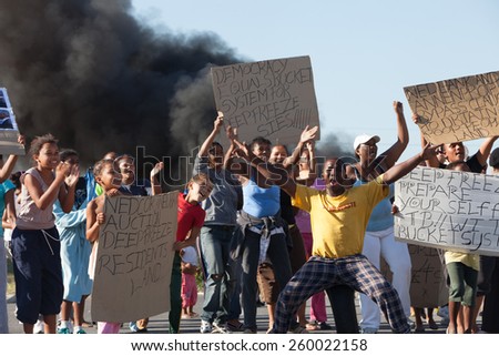 CAPE TOWN, SOUTH AFRICA - JANUARY 31: A large group of people protest against poor service delivery, in Cape Town, South Africa on January 31, 2012
