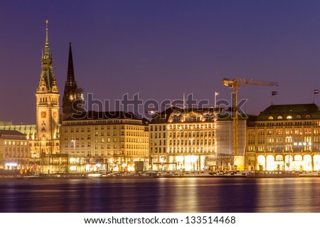 View across the Inner Alster Lake (Binnenalster) in Hamburg, Germany with the City Hall, the Nikolai and the Peter church
