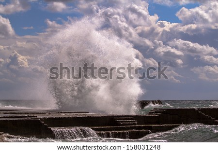 Dramatic wave during heavy storm weather conditions.
